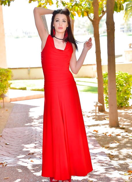 Sultry dark-haired babe Cali shows her ass in hot lingerie and loving sex toy outside